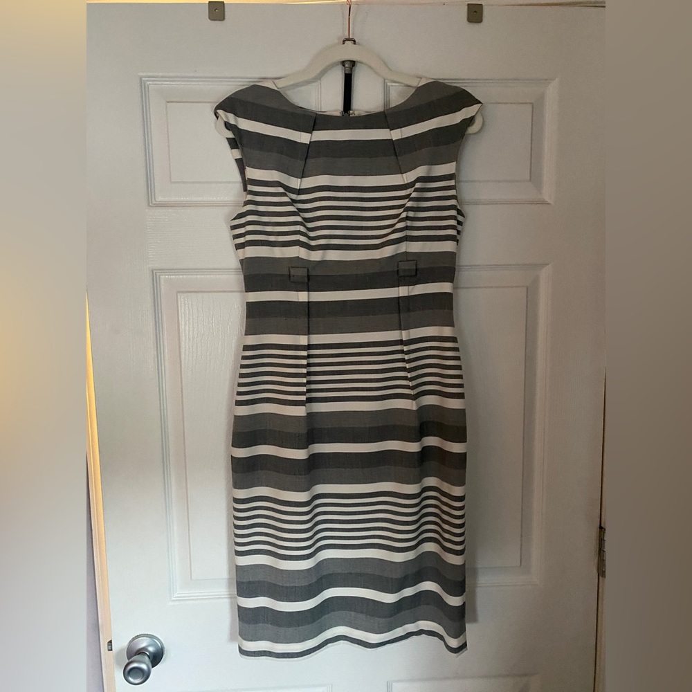 Knee length empire waist dress with belt to match.